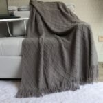 Smoky grey Nordic Minimalist Knit Throw Blanket â€“ 127Ã—180cm Lightweight, Soft & Breathable Fleece-like Fabric with Tassel Edges for Sofa, Bed, Yoga & Air Conditioning Use